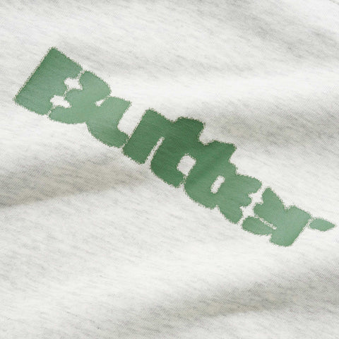 Green stylized wordmark printed on a heather grey fabric, angled diagonally across the garment.