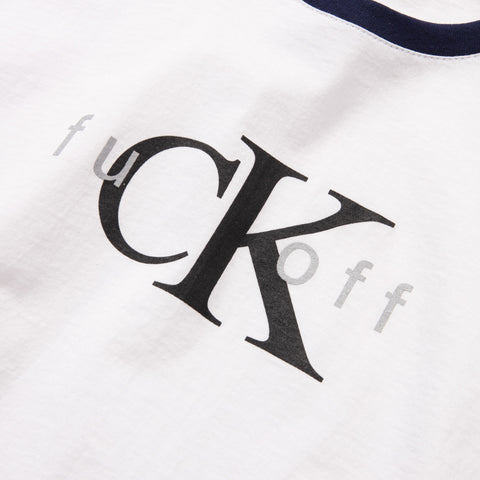 White cotton t-shirt with navy ringer collar, printed with a large black CK monogram and the words 'fuck off' in grey text around it.