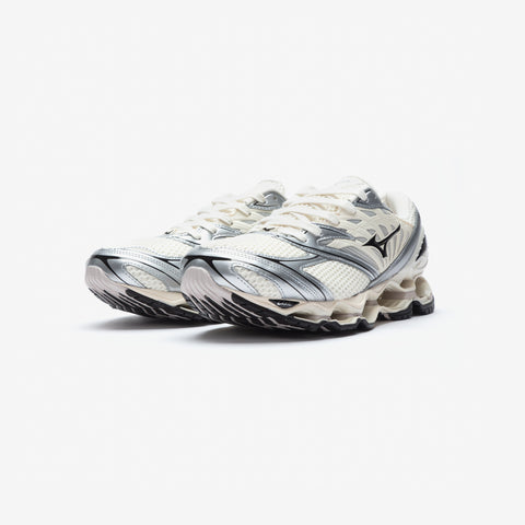Pair of white running shoes with silver metallic accents, black details, and a segmented pale sole, shown from the front three-quarter angle on a white background.