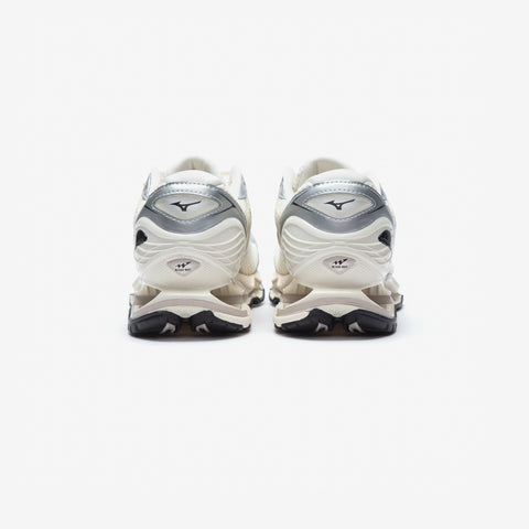 Rear view of a white and silver athletic running shoe with a sculpted, layered midsole and black outsole, on a plain white background.