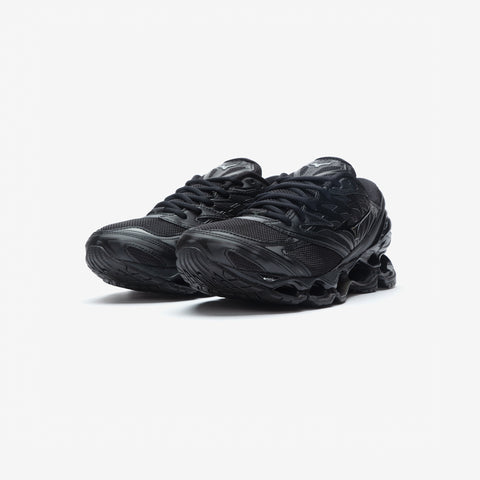 Pair of all-black running shoes with mesh uppers, black laces, and wavy sculpted midsoles, shown from a front three-quarter angle on a white background.