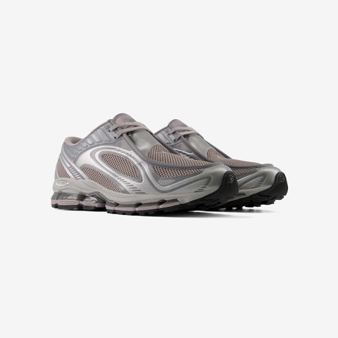 Pair of grey and taupe athletic running shoes with silver mesh panels, pod-style cushioned soles, and black rubber outsoles, shown at a three-quarter angle.
