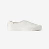 White leather slip-on sneaker with a low-cut collar and off-white rubber sole, shown in profile on a plain background.